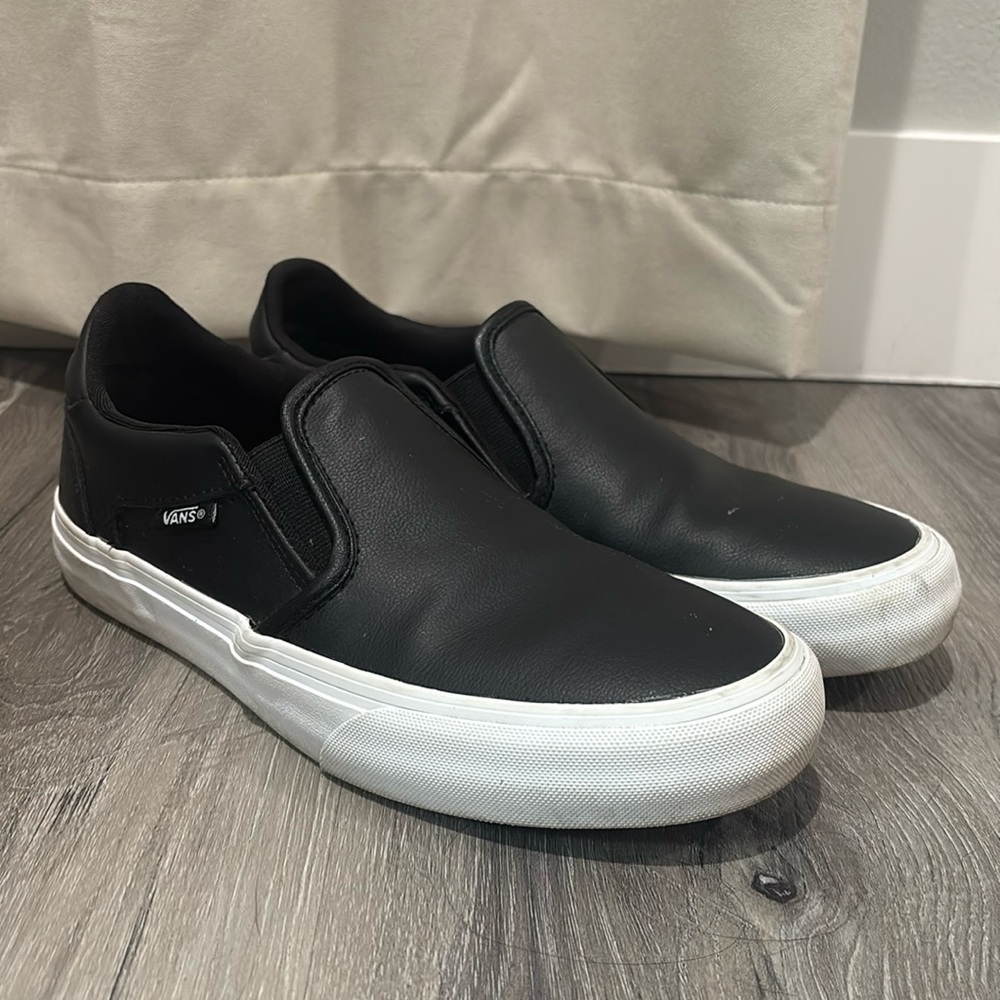 Black leather slip on Vans. Women’s size 8.5.